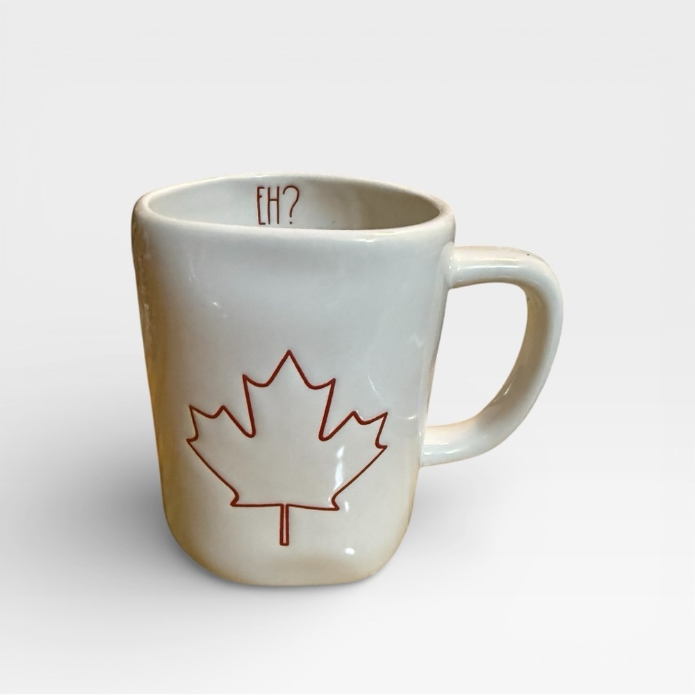 Rae Dunn Canadian Maple Leaf mug w/ the word "EH?" written inside the rim